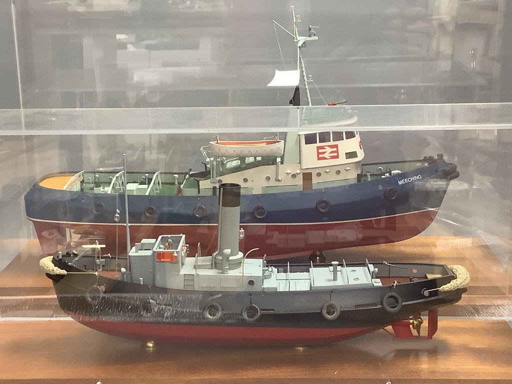 A scale model of the British Railways tug 'Meeching' (Newhaven) and another smaller model of a tug